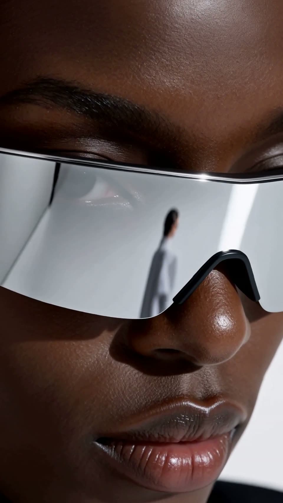 Two fashion models wearing futuristic eyewear